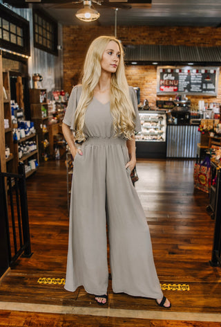 Uptown Elegance Smocked Jumpsuit In Beige